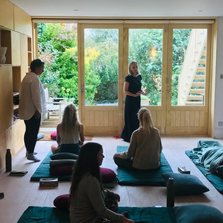 Clare guiding a group workshop in embodiment practices and breathwork in London